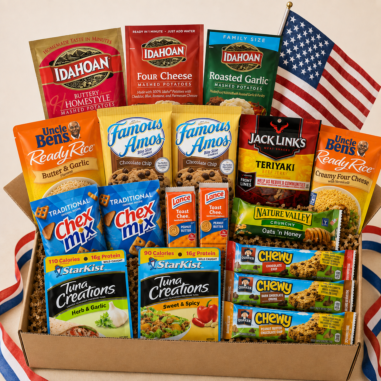 American snack care package gift box with assorted brand-name snacks and patriotic ribbon